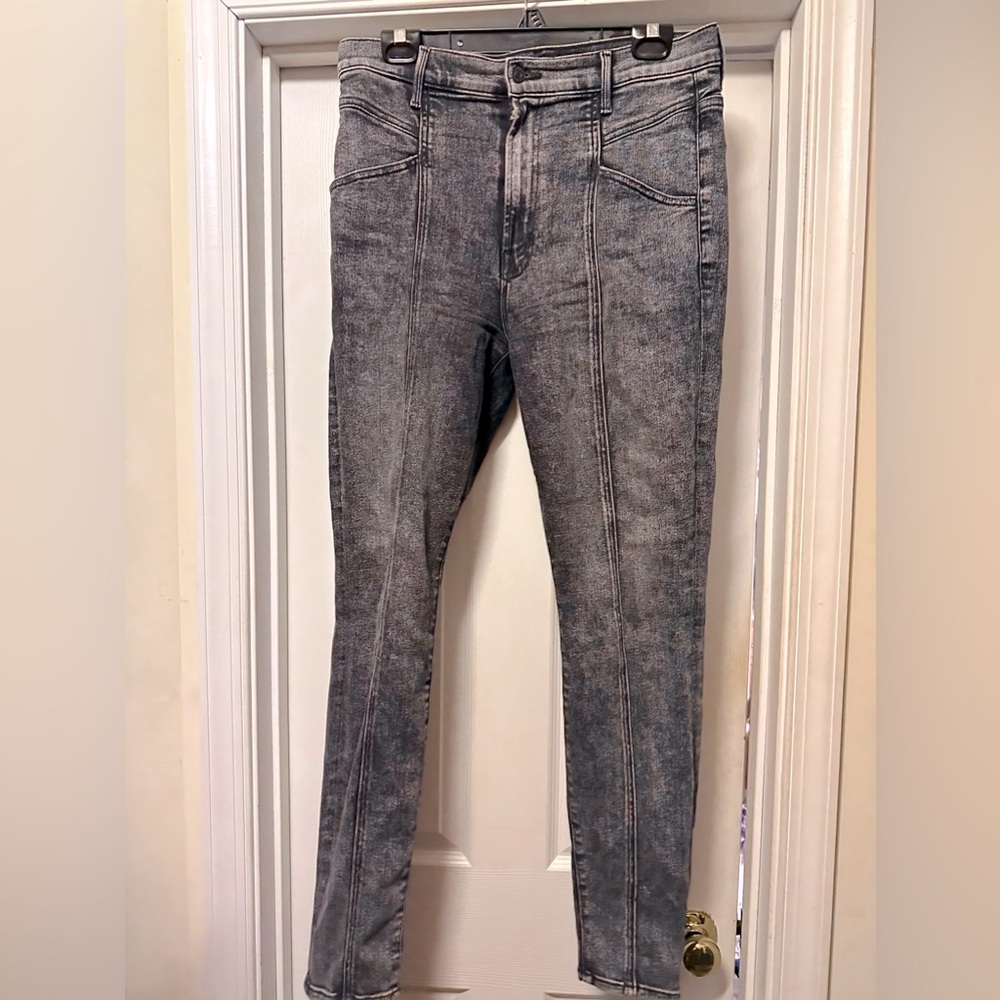 Mother Jeans in black stonewash, middle seam down the leg.